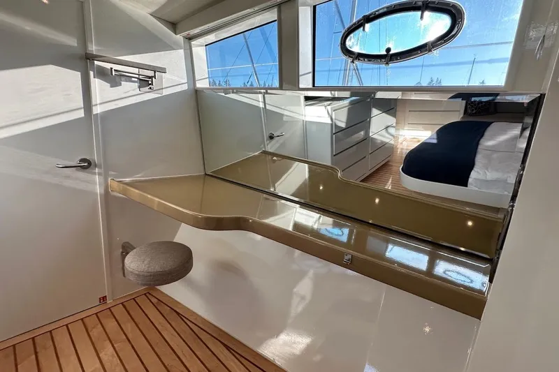 First Home Yacht Photos Pics Interior of 1988 Cheoy Lee 92 yacht with modern design and wooden flooring.