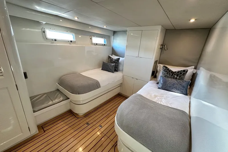 First Home Yacht Photos Pics Luxurious twin cabin interior of 1988 Cheoy Lee 92 yacht with modern decor.