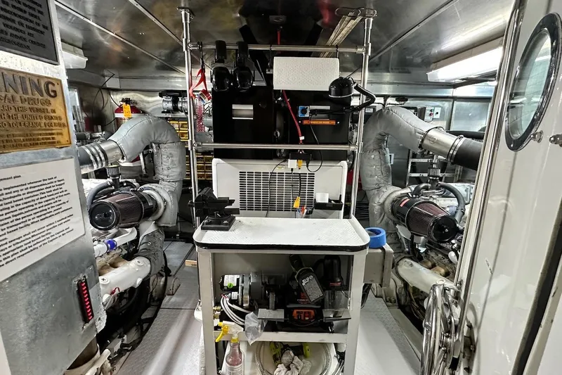 First Home Yacht Photos Pics Engine room of 1988 Cheoy Lee 92 yacht, featuring complex machinery and equipment.