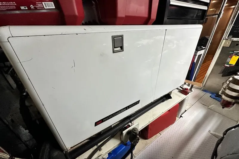 First Home Yacht Photos Pics Engine room of 1988 Cheoy Lee 92 yacht with Northern Lights generator.