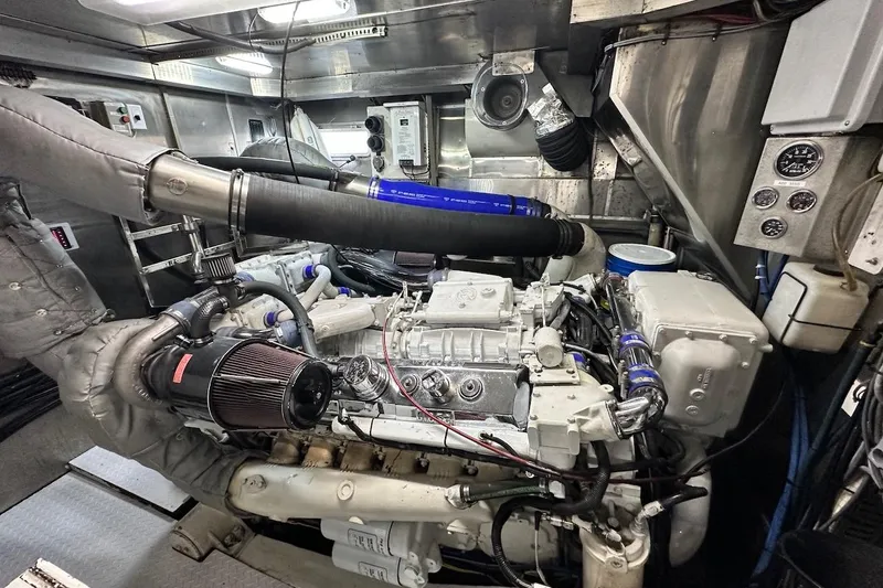 First Home Yacht Photos Pics Engine room of a 1988 Cheoy Lee 92 yacht, showcasing mechanical components and systems.