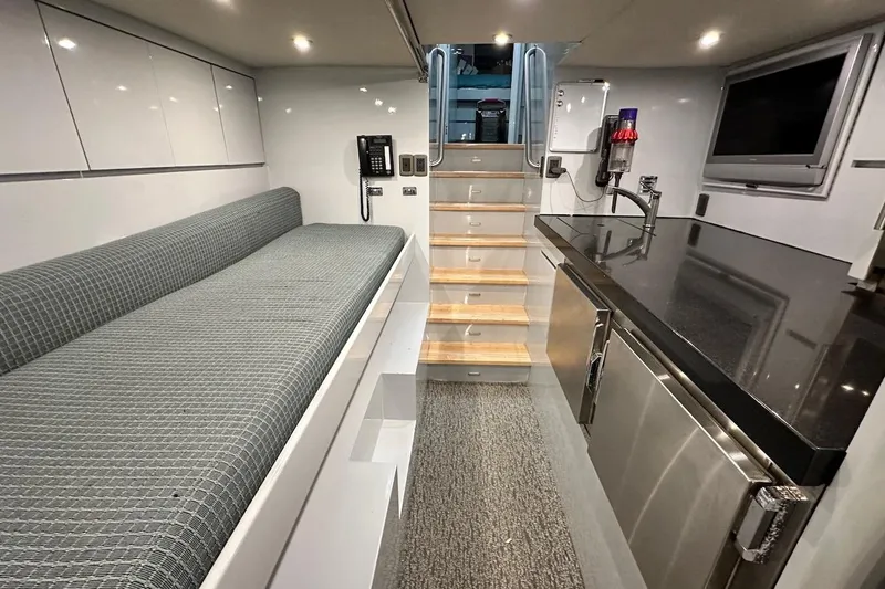 First Home Yacht Photos Pics Luxurious interior of 1988 Cheoy Lee 92 yacht with modern amenities and sleek design.