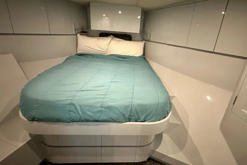 First Home Yacht Photos Pics Luxurious bedroom interior of 1988 Cheoy Lee 92 yacht with modern design.