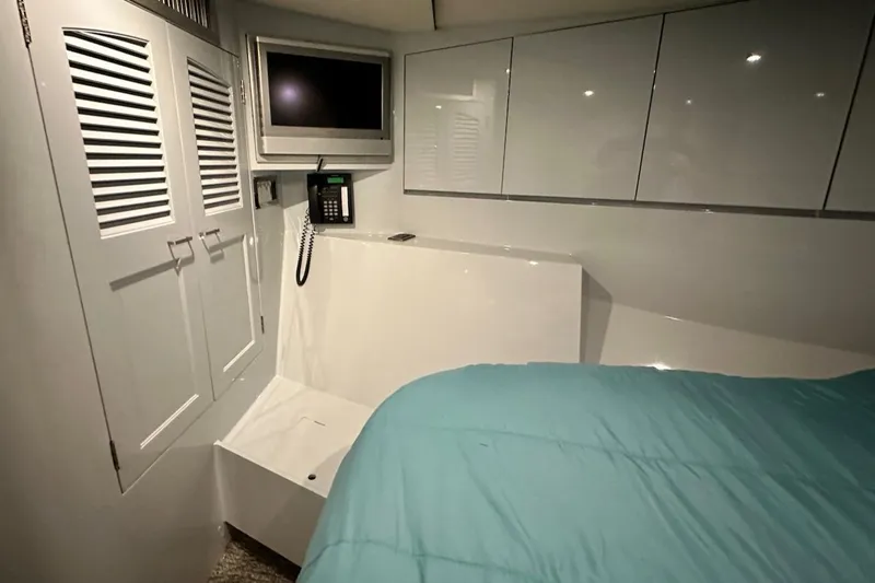 First Home Yacht Photos Pics Luxurious 1988 Cheoy Lee 92 yacht cabin with modern amenities and sleek design.