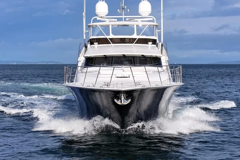 First Home Yacht Photos Pics 1988 Cheoy Lee 92 yacht cruising on open sea under clear skies.