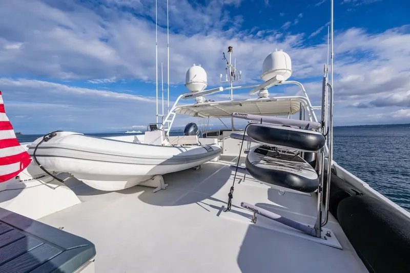 First Home Yacht Photos Pics 1988 Cheoy Lee 92 yacht deck with lifeboat and ocean view.