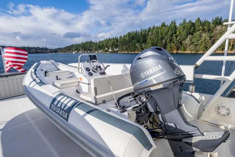First Home Yacht Photos Pics A 1988 Cheoy Lee 92 yacht with a Novurania tender and Yamaha outboard motor.