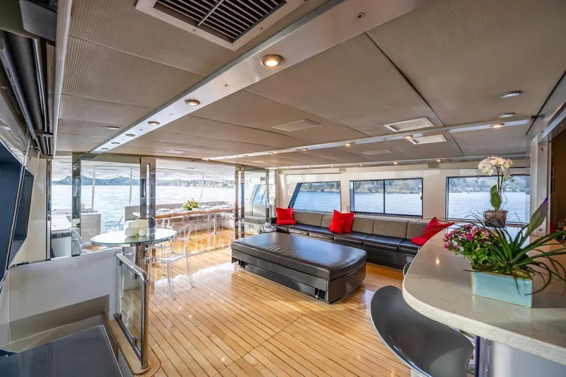 First Home Yacht Photos Pics Luxurious interior of 1988 Cheoy Lee 92 yacht with modern furnishings and scenic views.