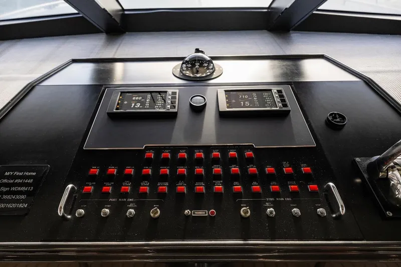 First Home Yacht Photos Pics Control panel of a 1988 Cheoy Lee 92 yacht, featuring navigation instruments and switches.