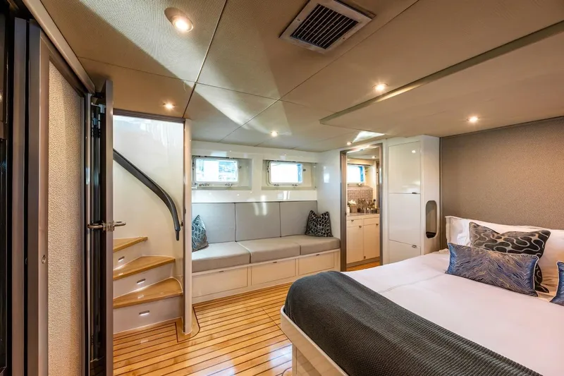 First Home Yacht Photos Pics Luxurious 1988 Cheoy Lee 92 yacht interior with elegant bedroom and seating area.