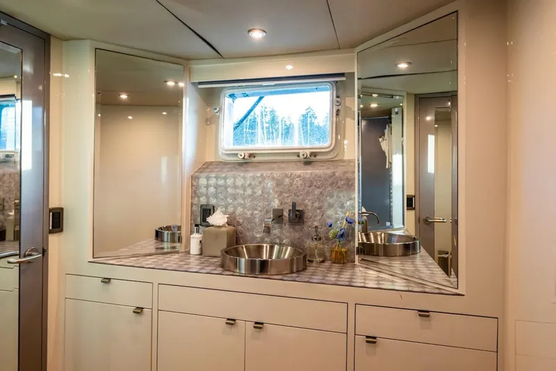 First Home Yacht Photos Pics Luxurious bathroom interior of 1988 Cheoy Lee 92 yacht with modern fixtures and elegant design.