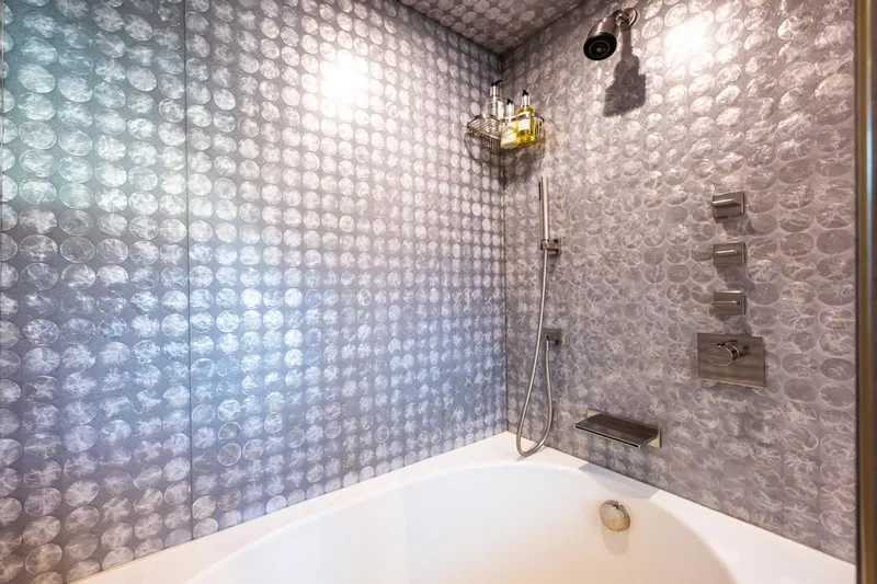 First Home Yacht Photos Pics Luxurious Cheoy Lee 92 yacht bathroom with modern shower and elegant tile design, 1988 model.