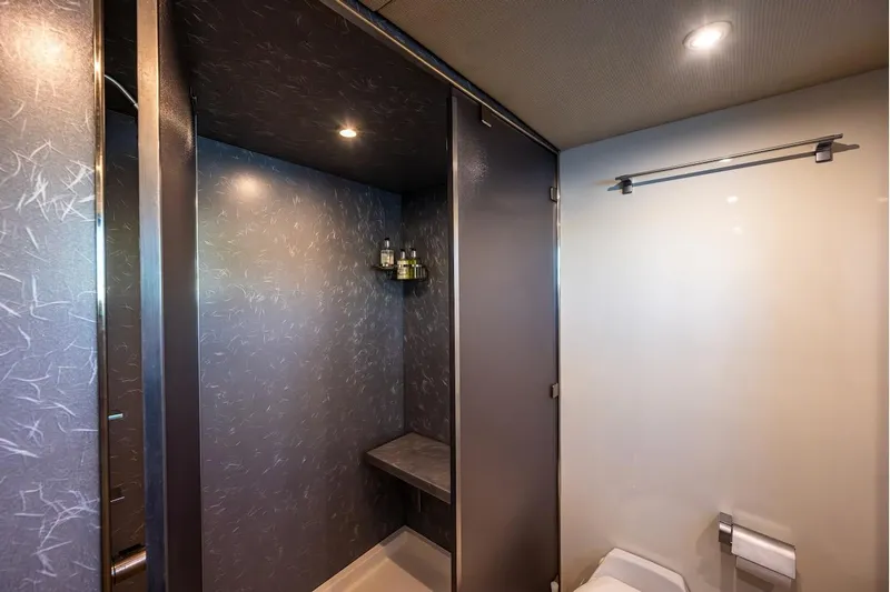 First Home Yacht Photos Pics Luxurious bathroom interior on 1988 Cheoy Lee 92 yacht, featuring modern shower and elegant design.