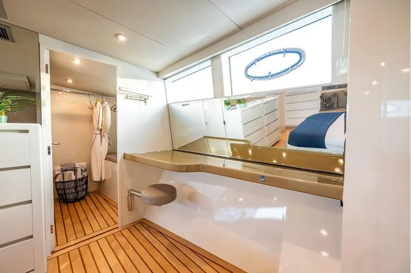 First Home Yacht Photos Pics Luxurious interior of 1988 Cheoy Lee 92 yacht with modern design and wooden flooring.