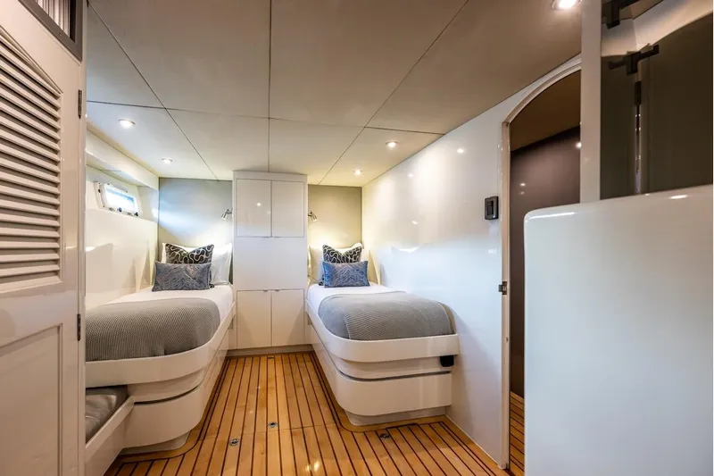 First Home Yacht Photos Pics Luxurious twin cabin interior on 1988 Cheoy Lee 92 yacht with modern decor.