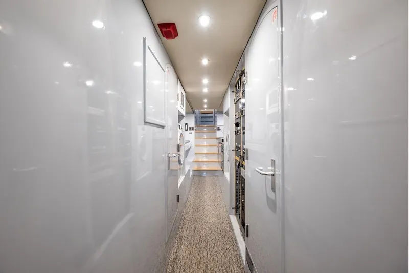 First Home Yacht Photos Pics Interior hallway of 1988 Cheoy Lee 92 yacht with modern design and lighting.