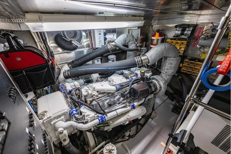 First Home Yacht Photos Pics Engine room of a 1988 Cheoy Lee 92 yacht, featuring complex machinery and equipment.