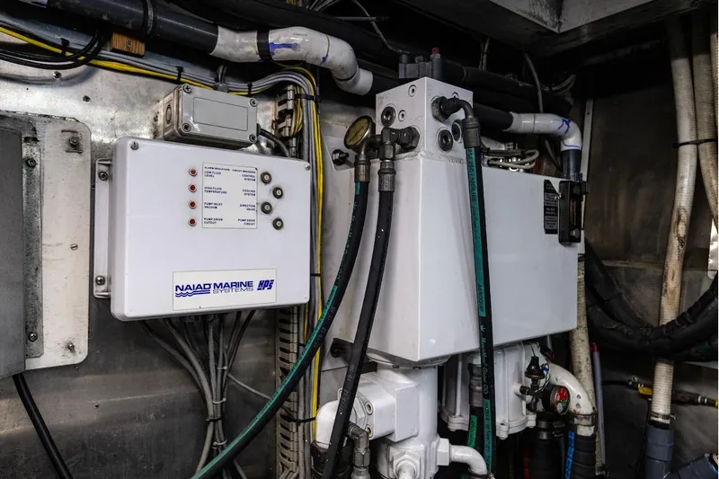 First Home Yacht Photos Pics Engine room of 1988 Cheoy Lee 92 yacht with Naiad Marine Systems equipment.