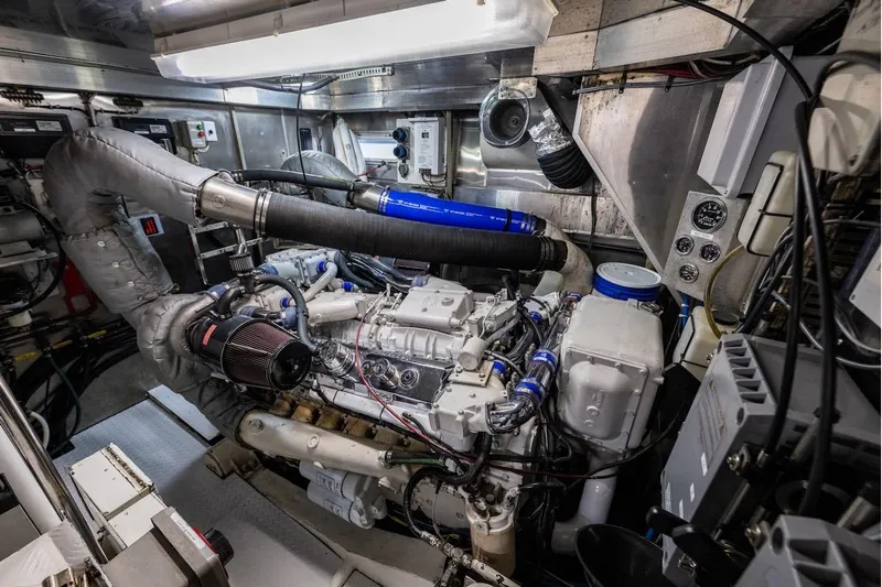 First Home Yacht Photos Pics Engine room of 1988 Cheoy Lee 92 yacht, showcasing complex machinery and components.