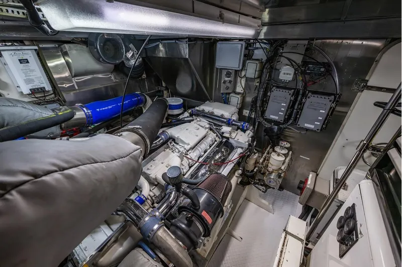 First Home Yacht Photos Pics Engine room of 1988 Cheoy Lee 92 yacht, showcasing complex machinery and equipment.