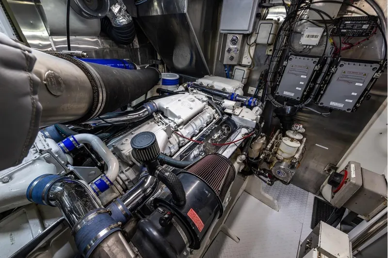 First Home Yacht Photos Pics Engine room of 1988 Cheoy Lee 92 yacht, showcasing complex machinery and wiring.