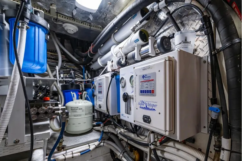 First Home Yacht Photos Pics Engine room of 1988 Cheoy Lee 92 yacht with Aqua Whisper watermaker system.