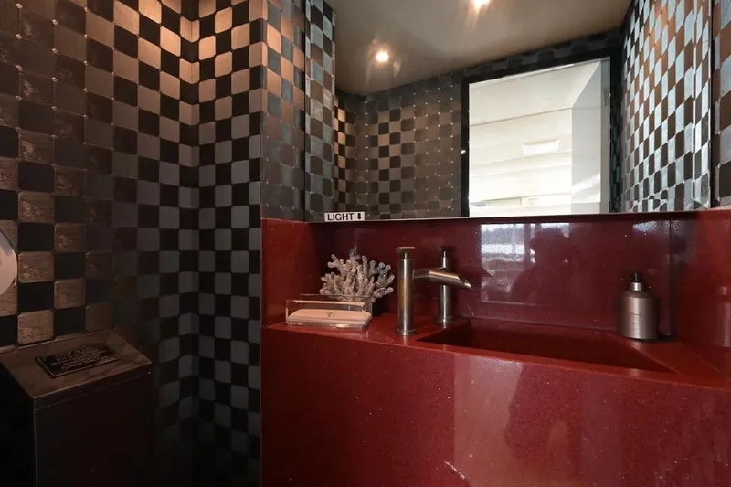 First Home Yacht Photos Pics Luxurious bathroom with red sink and checkered walls on 1988 Cheoy Lee 92 yacht.