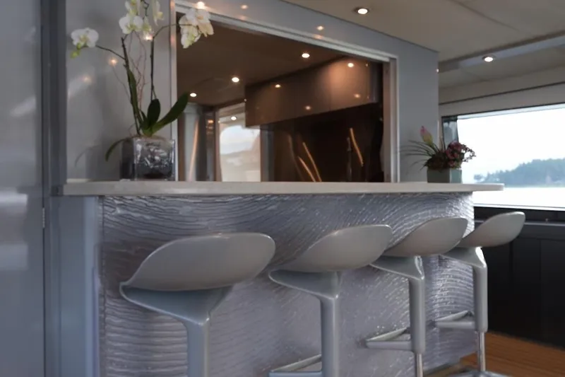 First Home Yacht Photos Pics Luxurious interior of 1988 Cheoy Lee 92 yacht with modern bar and elegant seating.