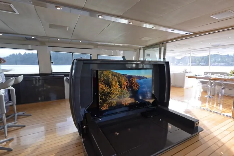 First Home Yacht Photos Pics Luxurious interior of 1988 Cheoy Lee 92 yacht with pop-up TV and scenic view.