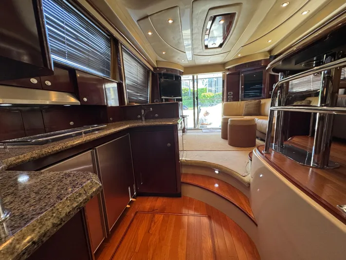 Last Mango Yacht Photos Pics Luxurious interior of 2007 Sea Ray 52 Sedan Bridge yacht with elegant wood finishes.