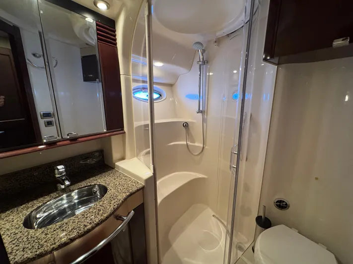 Last Mango Yacht Photos Pics Luxurious bathroom in 2007 Sea Ray 52 Sedan Bridge yacht with shower and granite countertop.