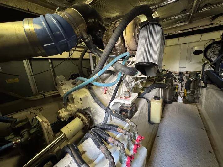 Last Mango Yacht Photos Pics Engine room of a 2007 Sea Ray 52 Sedan Bridge with visible components and hoses.