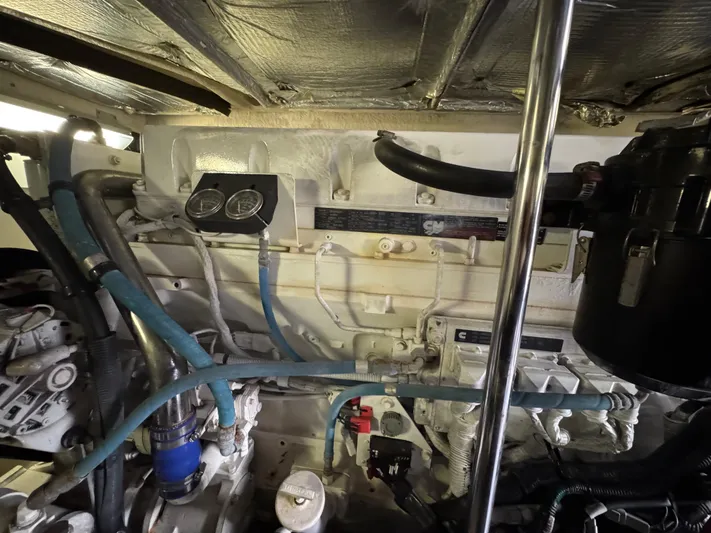 Last Mango Yacht Photos Pics Engine room of a 2007 Sea Ray 52 Sedan Bridge with visible components and wiring.