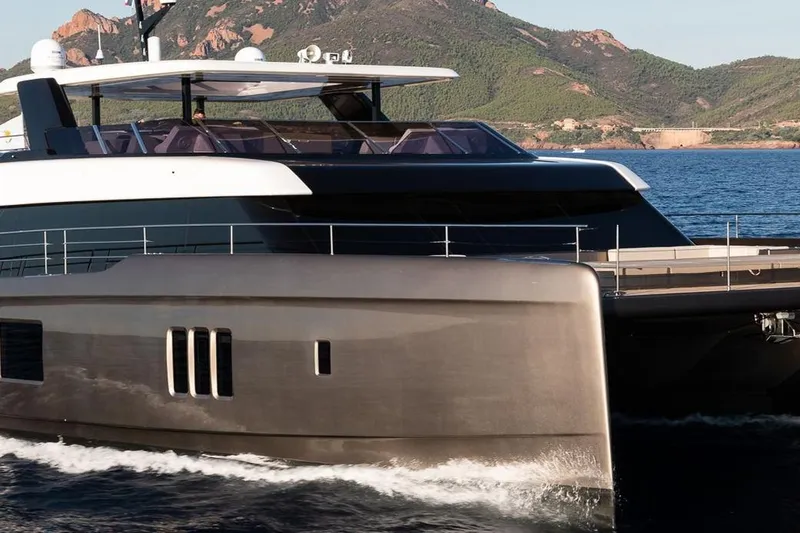 Ellen's Dream Yacht Photos Pics Luxurious 2020 Sunreef 80 Power yacht cruising near scenic coastline.