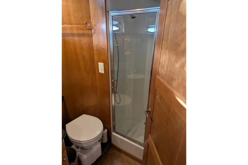 Impulse Yacht Photos Pics Compact bathroom in 2004 Navigator 57 with shower and toilet.