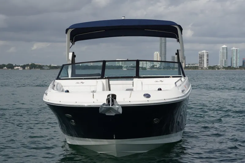  Yacht Photos Pics 2018 Sea Ray SDX 290 boat on water with city skyline background.