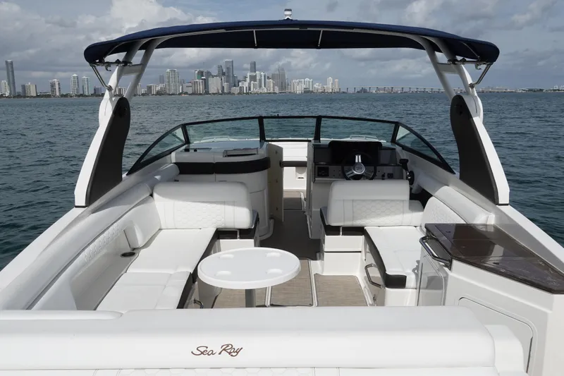  Yacht Photos Pics 2018 Sea Ray SDX 290 boat interior with city skyline in the background.
