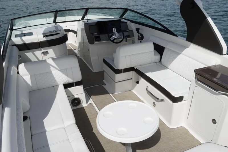  Yacht Photos Pics 2018 Sea Ray SDX 290 boat interior with luxurious white seating and modern dashboard.