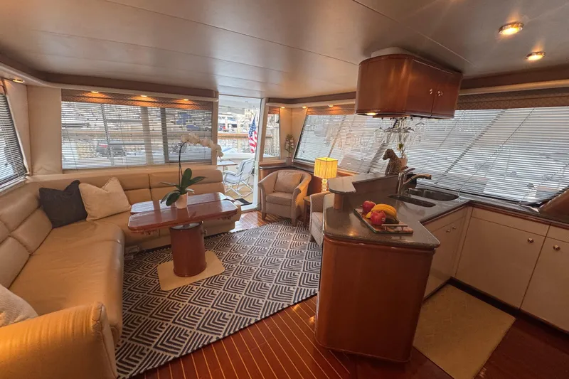 Alexandra Yacht Photos Pics Luxurious interior of 1998 Bayliner 4788 Pilot House Motoryacht with elegant seating and kitchen area.