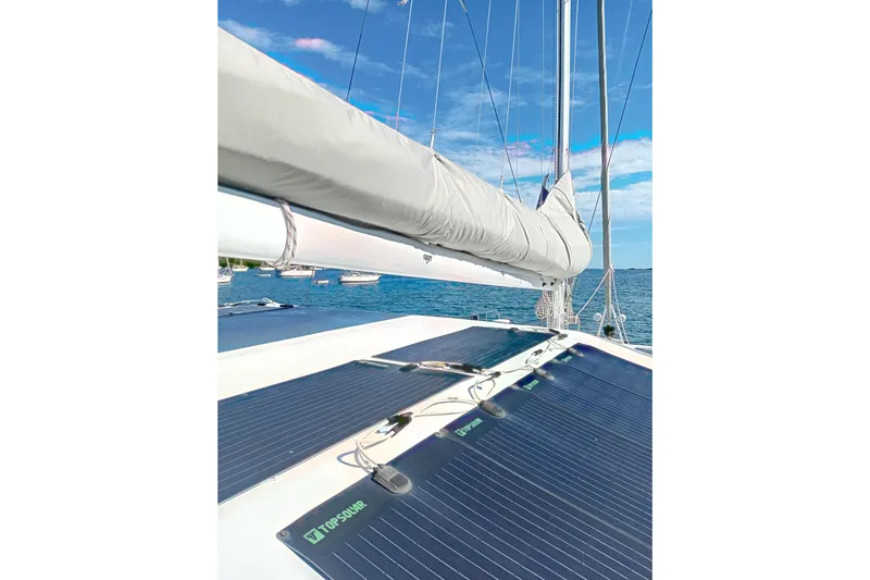  Yacht Photos Pics Sailing catamaran Fountaine Pajot Marquises 56 with solar panels, 1995 model, on a sunny day.