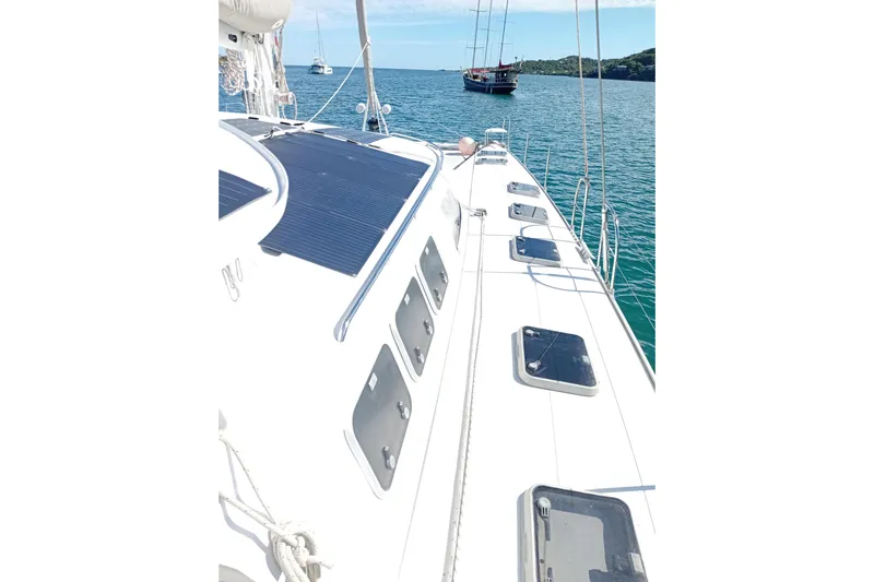  Yacht Photos Pics Sailing deck of 1995 Fountaine Pajot Marquises 56 catamaran on calm sea.