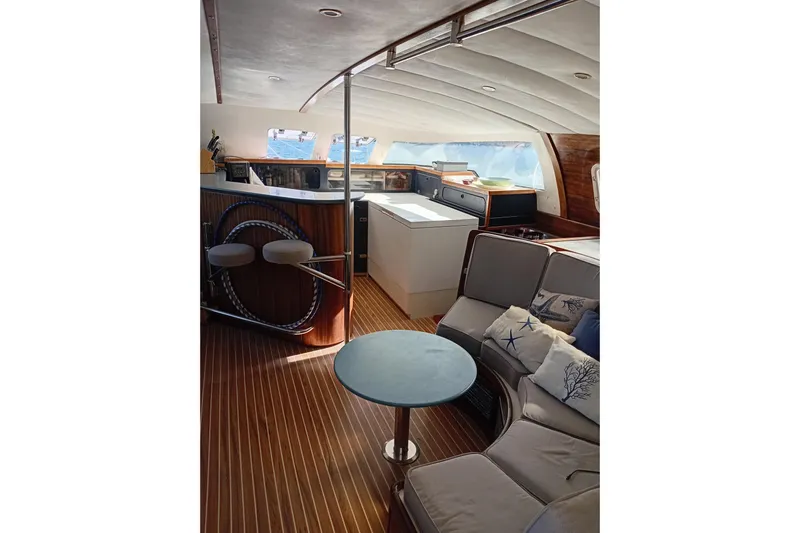  Yacht Photos Pics Interior of 1995 Fountaine Pajot Marquises 56 yacht with modern seating and wooden flooring.