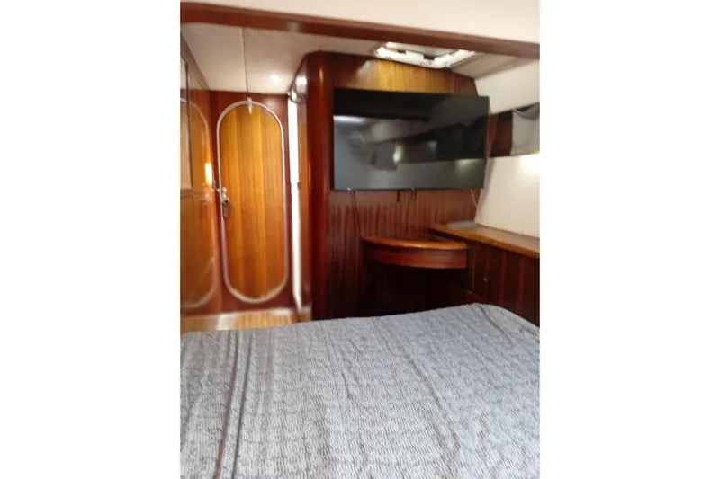  Yacht Photos Pics Interior cabin of 1995 Fountaine Pajot Marquises 56 yacht with wood paneling.