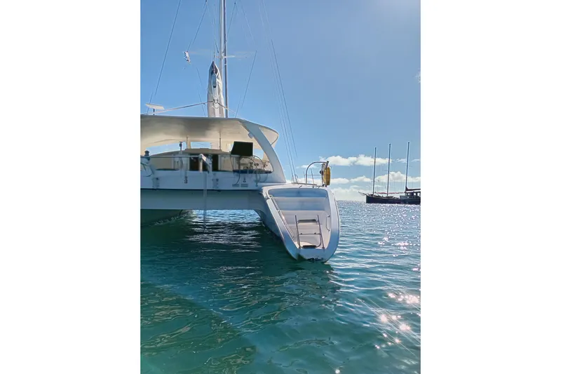  Yacht Photos Pics 1995 Fountaine Pajot Marquises 56 catamaran on serene blue water under clear sky.
