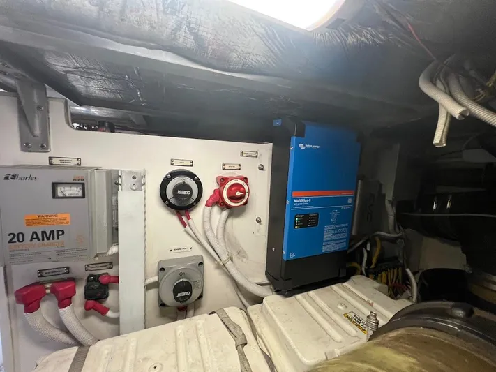 Roweboat Yacht Photos Pics Electrical system inside 2006 Carver 56 Voyager yacht, featuring battery charger and inverter.