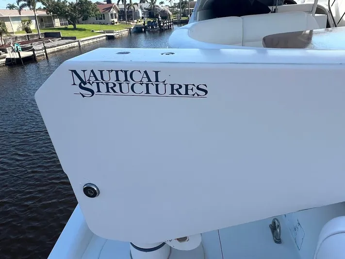 Roweboat Yacht Photos Pics 2006 Carver 56 Voyager yacht with "Nautical Structures" branding, docked by a canal.