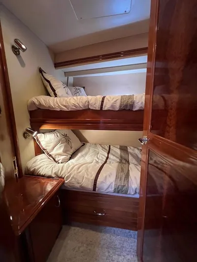 Roweboat Yacht Photos Pics Bunk beds in 2006 Carver 56 Voyager yacht cabin with wooden interior.