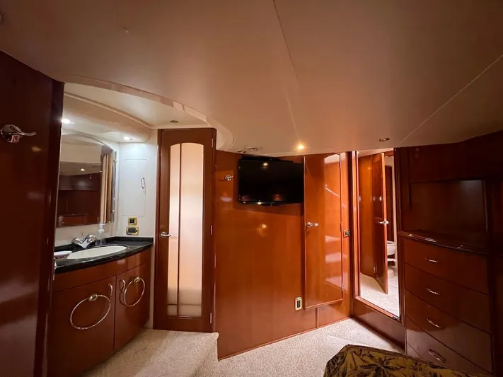 Roweboat Yacht Photos Pics Luxurious interior of 2006 Carver 56 Voyager yacht with wood finish and modern amenities.