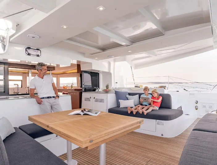 Martina Yacht Photos Pics Family relaxing on Lagoon 46 yacht's spacious deck, 2021 model.