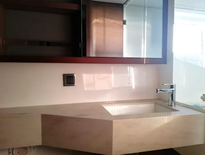 Martina Yacht Photos Pics Modern bathroom sink in 2021 Lagoon 46 yacht, featuring sleek design and elegant fixtures.